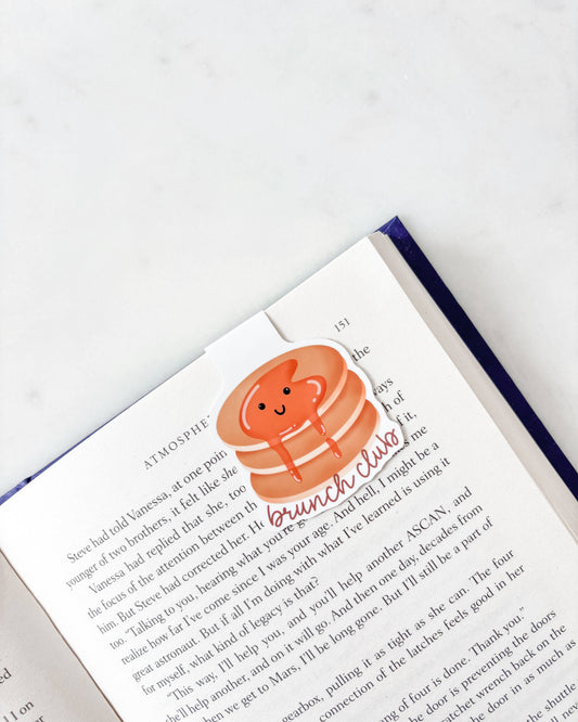 Book with a sticker of a pancake cartoon character on a white background
